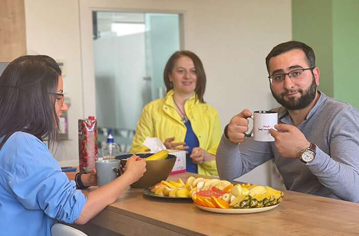 Three people having breakfast