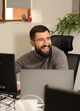 Man smiling and working in the office