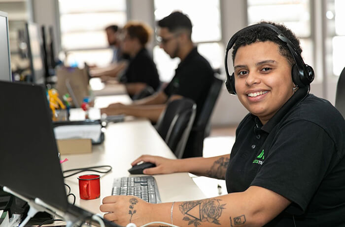 Questrade employee using a headset and working in the office