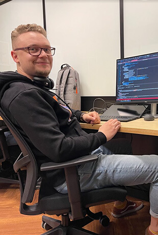 Men working on the computer