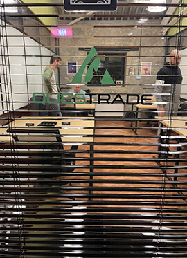 Questrade office in Ukraine, view of a glass window with Questrade logo printed